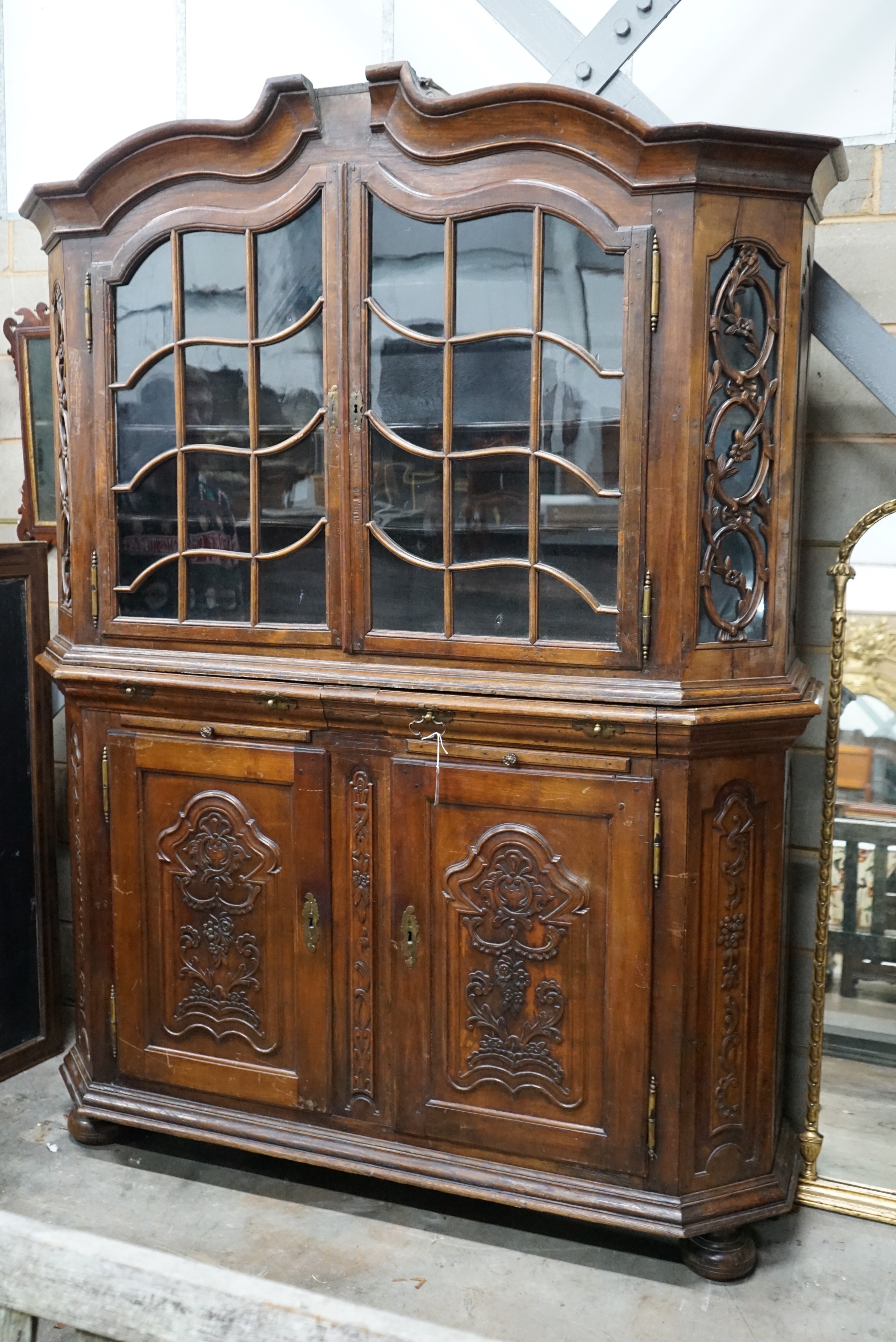 A 19th century Dutch oak and walnut glazed display cabinet, width 174cms, depth 47cms, height 227cms.